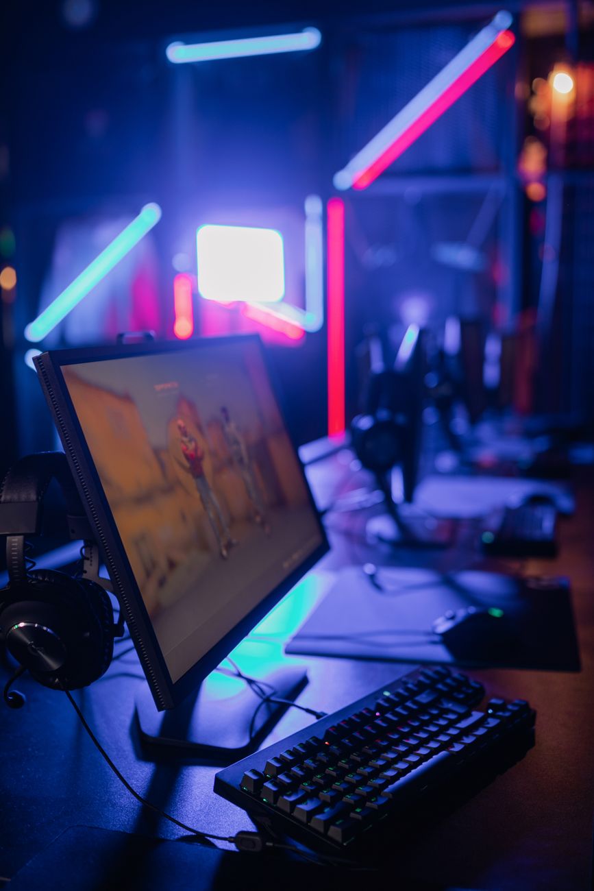Auckland tech lab background featuring neon lighting and screens